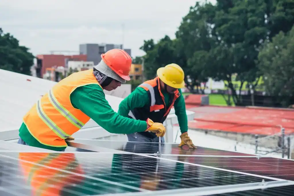 solar technicians installing solar panels 8853536
